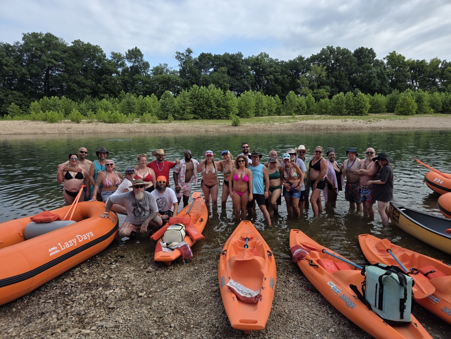 OTB Float Trip group photo in the river with kayaks and rafts