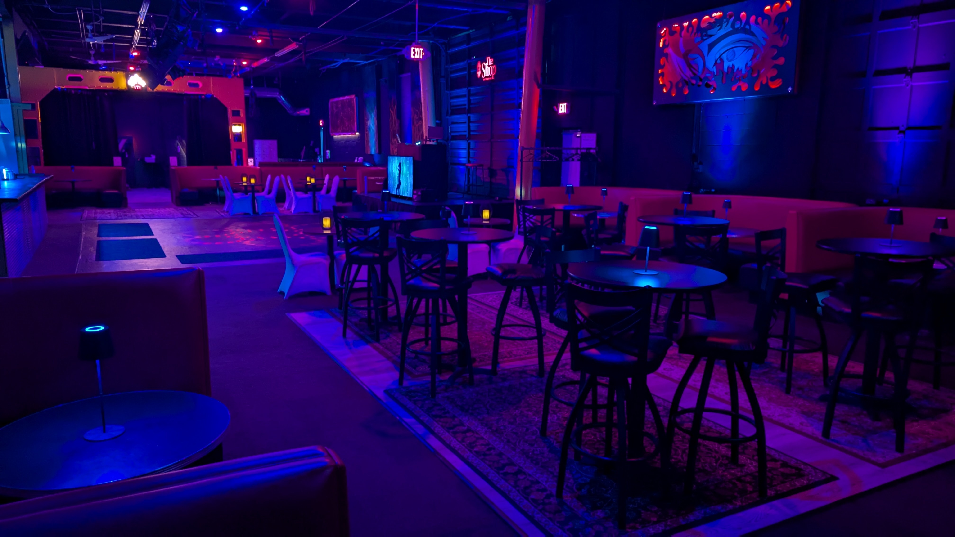 The Shop main lounge with warm lighting and seating